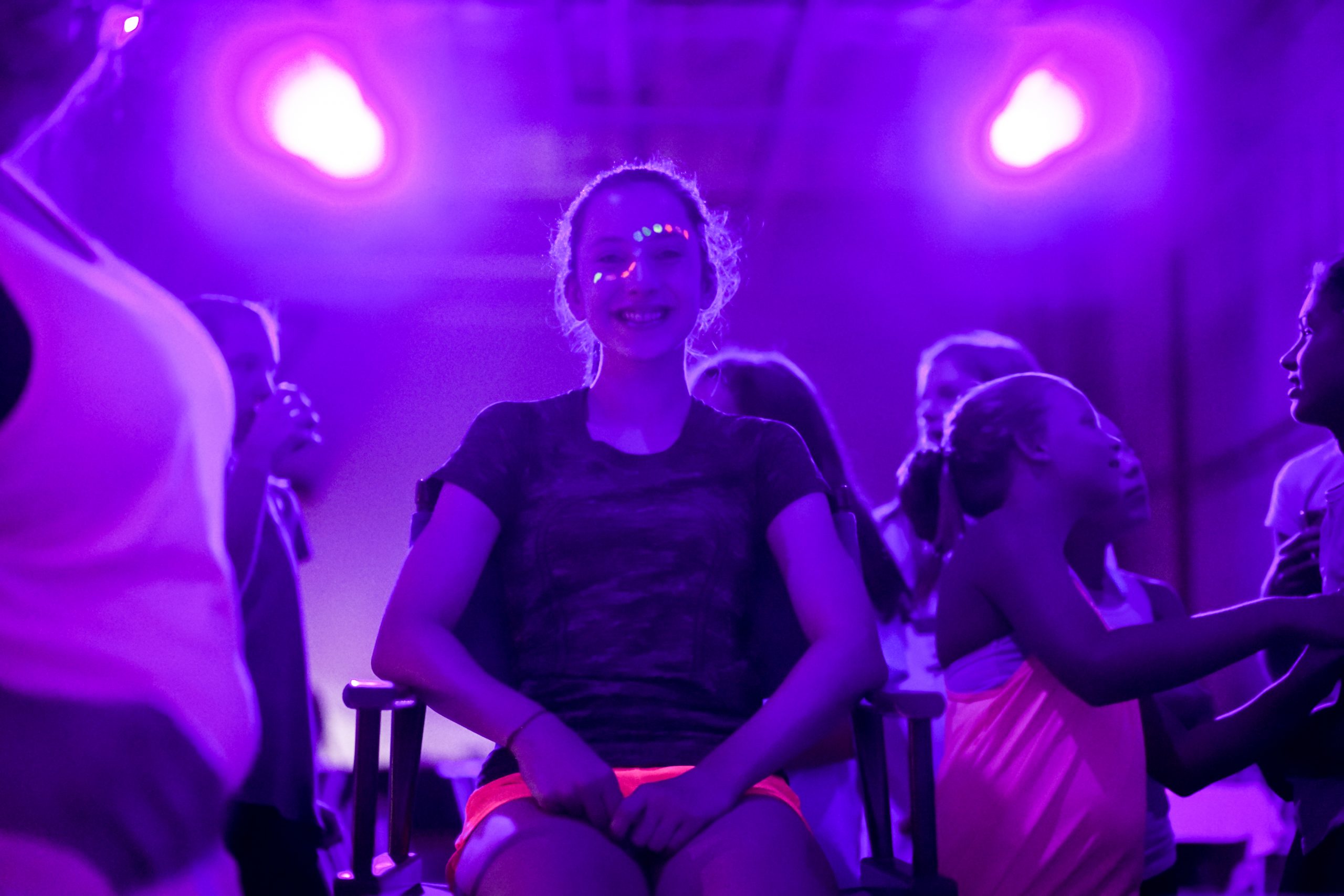 Teenage girl smiling with face pain on during a bar mitzvah at Group Dynamix