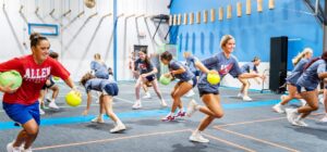 volleyball sports team playing dodgeball during team building event at Group Dynamix