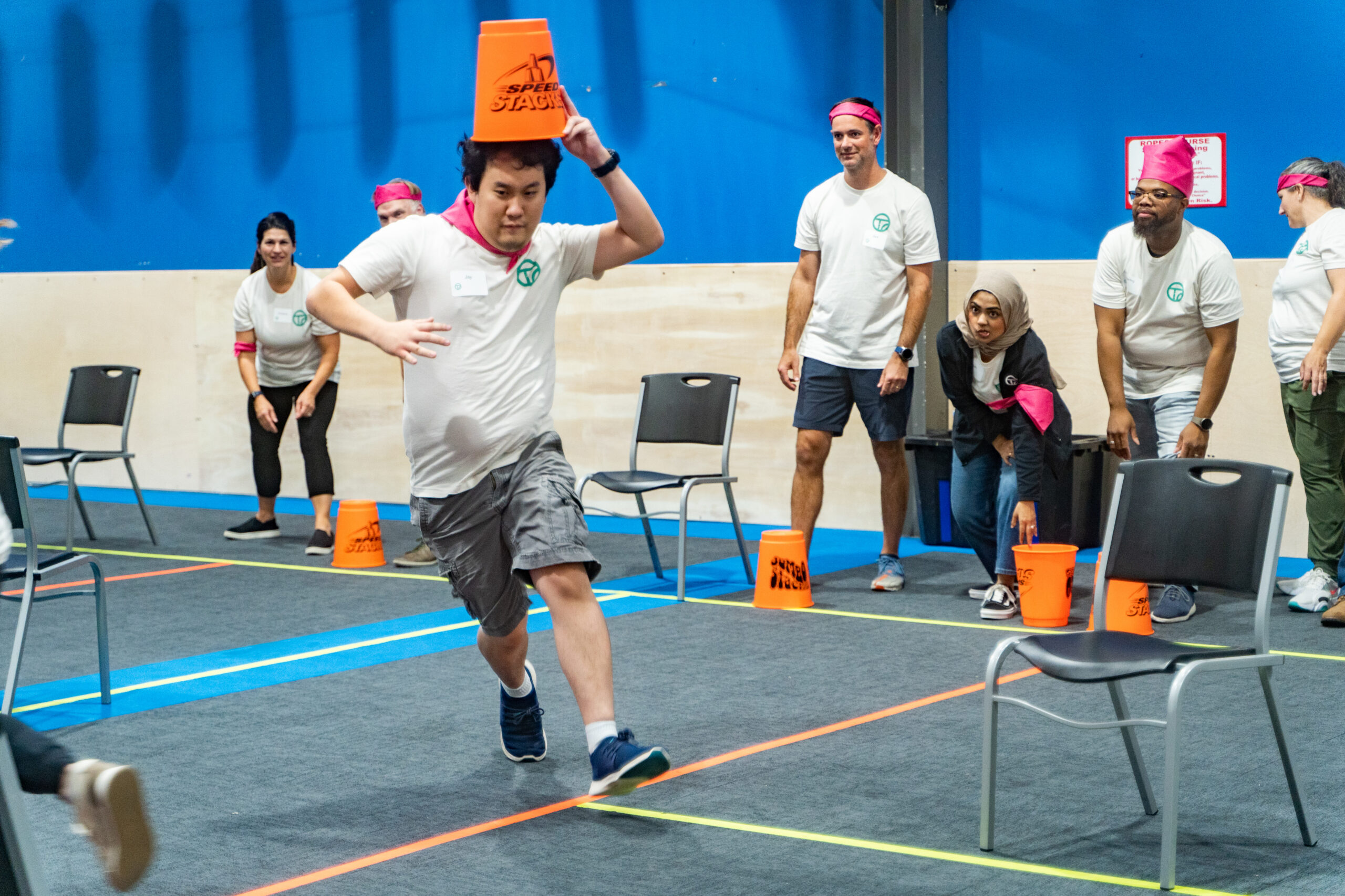Workshop participants taking part in an energetic team challenge