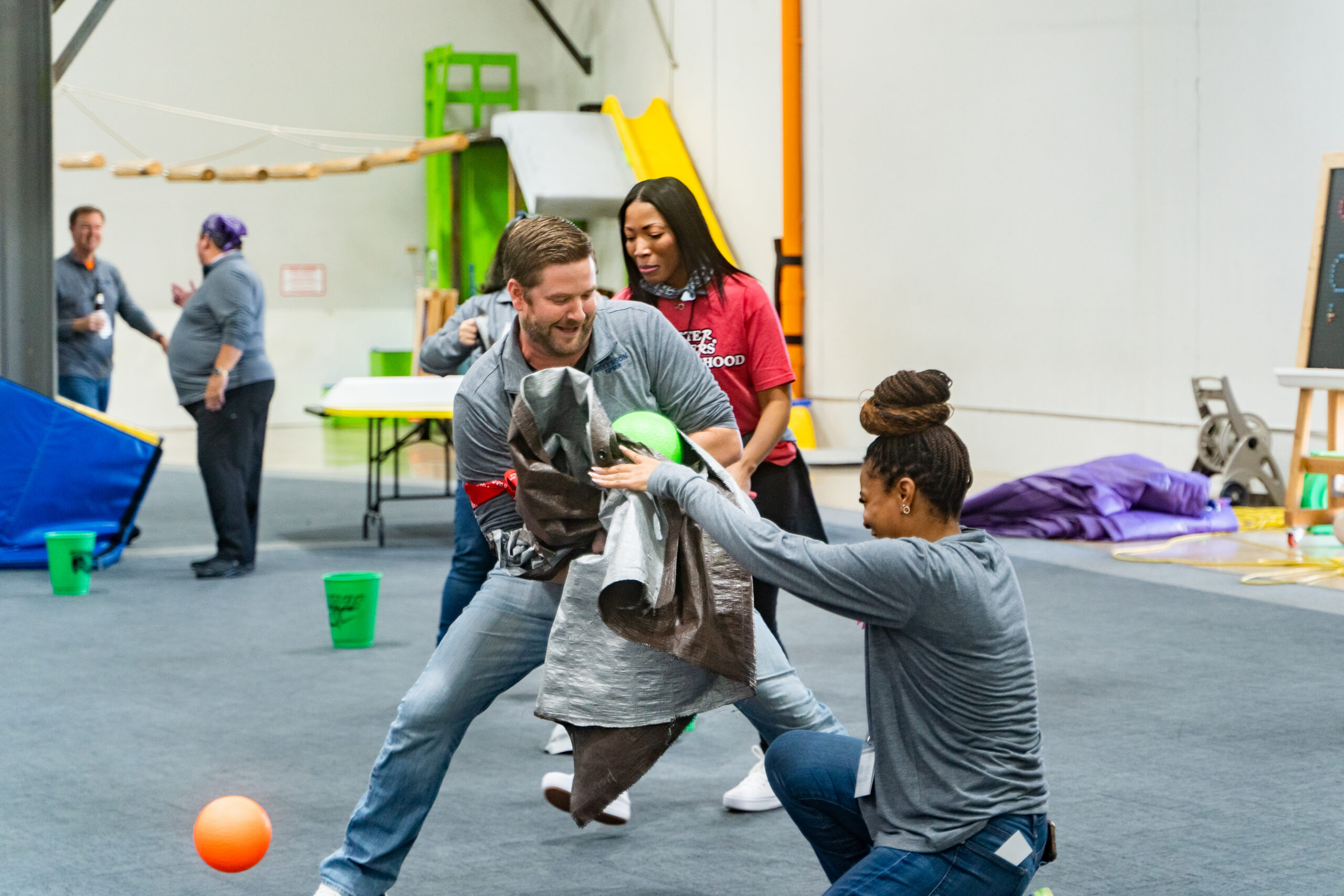 Workshop participants collaborating during a playful challenge